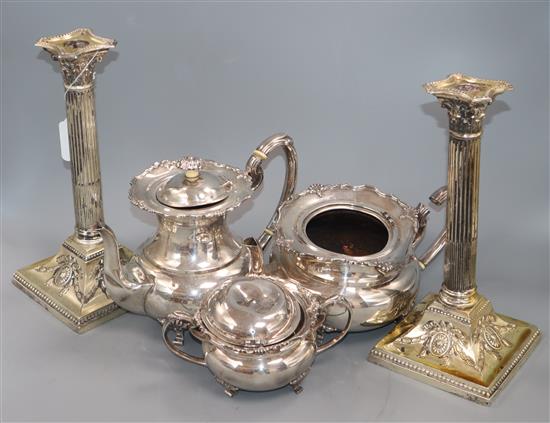A pair of Edwardian silver corinthian column candlesticks, with loaded bases, Sheffield 1902, height 29cm (a.f.) and a
